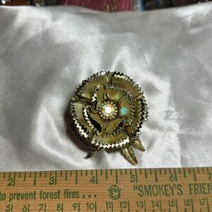 Gold Tone Flower Brooch w/ Aurora Borealis crystal in center-vintage & beautiful